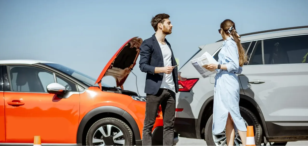 Car crash lawyer maximizing injury settlements Car crash lawyer reviewing an auto accident claim to maximize the injury settlement