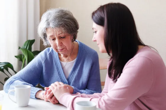 Wrongful death lawyer supporting a grieving woman after the fatal loss of a loved one